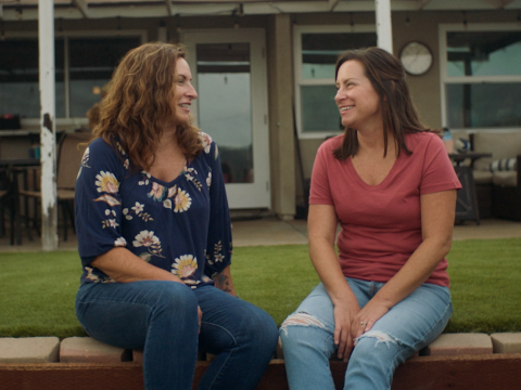 Joy and Erica sitting on a bench