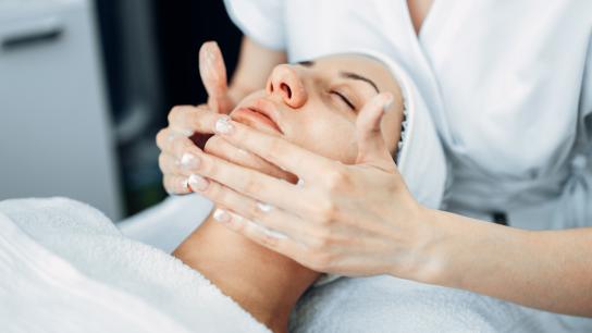 Woman receiving sagging skin treatment on her face