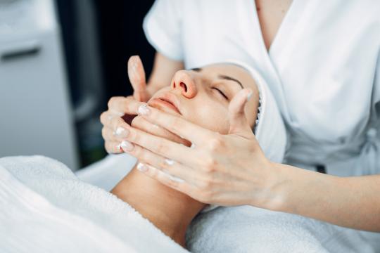 Woman receiving sagging skin treatment on her face